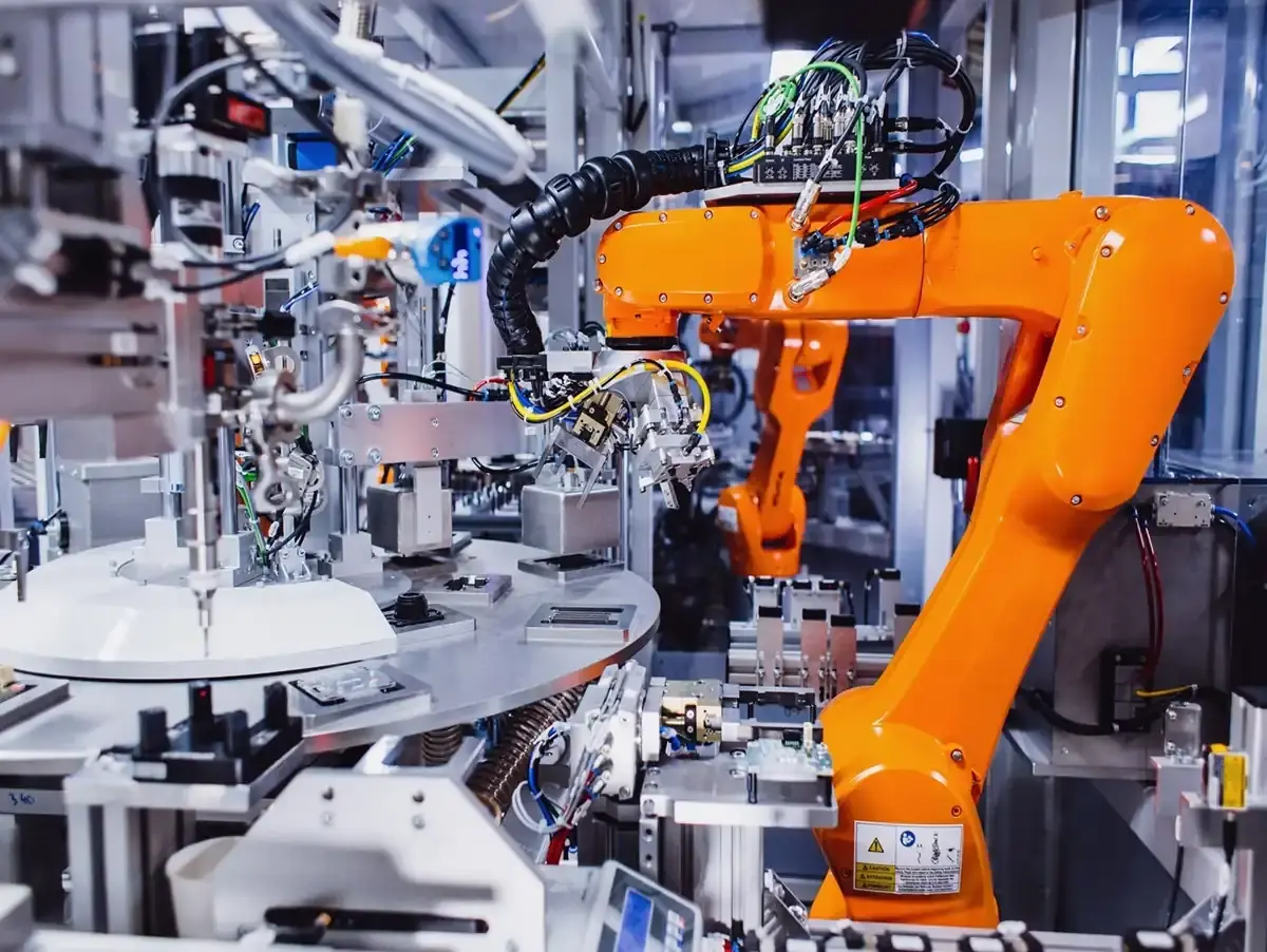 View of an automated industrial robot and rotary indexing assembly machine in modern manufacturing for custom machines and testing technology at AWM Arnstadt.