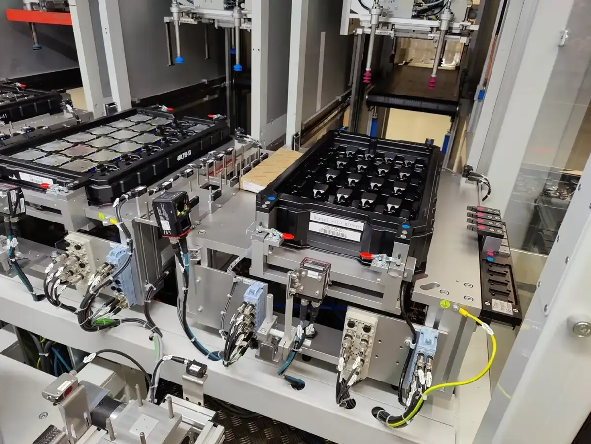 View of an automated handling and feeding system with workpiece carriers and magazines for industrial custom machine building at AWM Arnstadt.