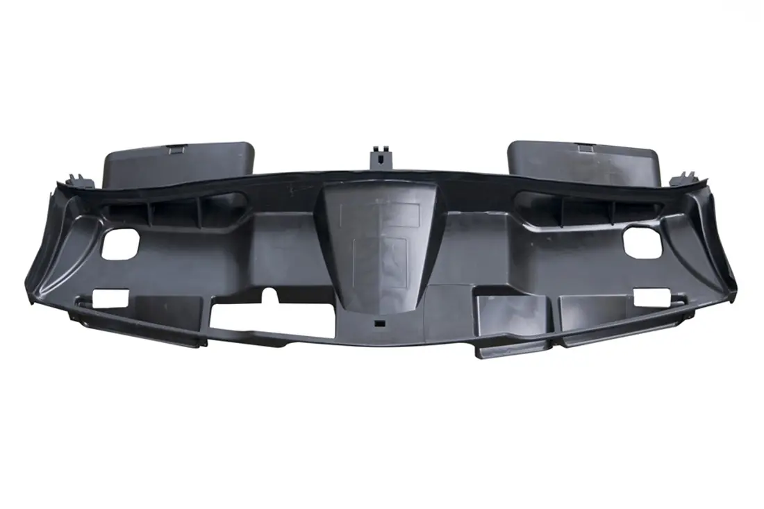 Black injection-molded plastic component (air filter housing cover) isolated on a white background.